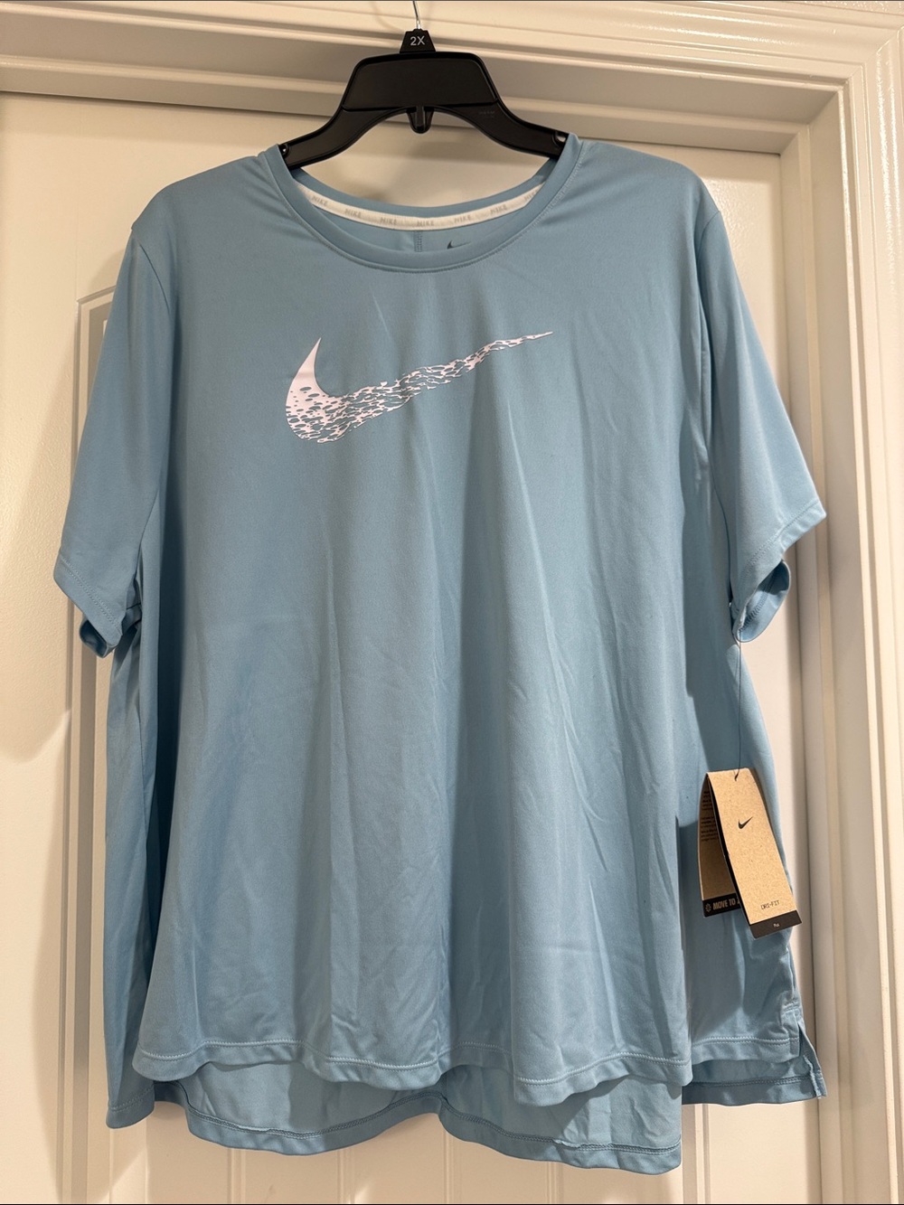 Nike Light Blue Performance Tee with White Swoosh.